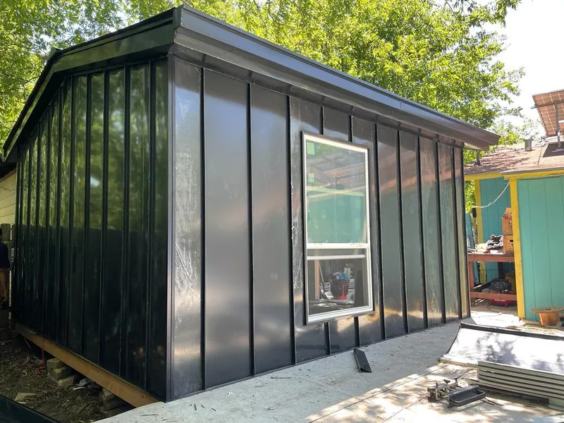 Black standing seam metal wall panels for Roof Inspection in Harper Woods