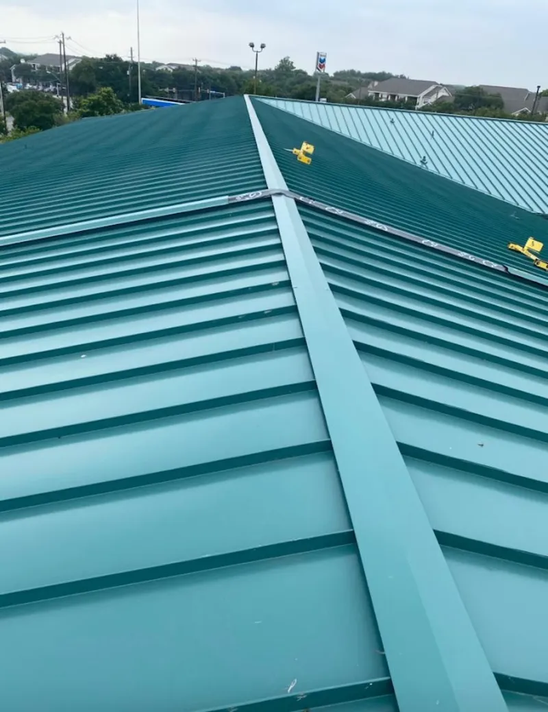 Green commercial metal roof ridge and valley for Metal Roof Repair in Harper Woods